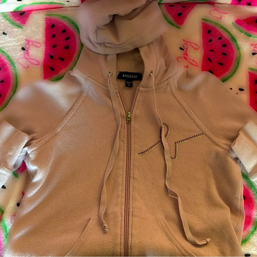 LIGHT PINK BEBE SWEATER SIZE MEDUIM (FITS A SMALL)